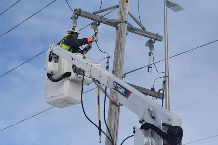 Tyler Villarreal, a Cass County Electric Cooperative line worker, uses the PAL device on the job in North Dakota.