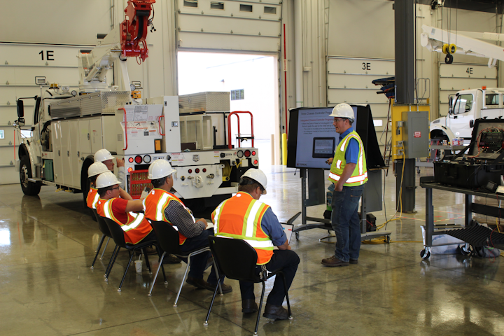 Kaid Knox, Terex national service technician, covers chassis controllers during the Terex Service School in June.